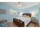 Bedroom with light blue walls, bamboo bed frame, and wood floors at 831 Via Tunis, Punta Gorda, FL 33950