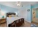 Bedroom with light blue walls, bamboo bed frame, and wood floors at 831 Via Tunis, Punta Gorda, FL 33950