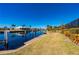 Peaceful view of a canal with homes reflecting in the water at 831 Via Tunis, Punta Gorda, FL 33950