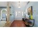 Light and bright entryway with hardwood floors and decorative console table at 831 Via Tunis, Punta Gorda, FL 33950