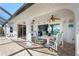 Covered patio with table and chairs, offering view of canal at 831 Via Tunis, Punta Gorda, FL 33950