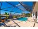 Enclosed pool area with patio and relaxing seating at 831 Via Tunis, Punta Gorda, FL 33950