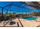 Enclosed pool and patio area with lounge chairs and canal view at 831 Via Tunis, Punta Gorda, FL 33950