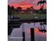 Beautiful sunset over the canal, reflecting on the water at 831 Via Tunis, Punta Gorda, FL 33950