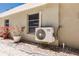 Home exterior featuring an AC unit and landscaping at 2112 Mark Ave, Punta Gorda, FL 33950