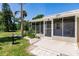 Inviting front porch with ample seating and screened enclosure at 2112 Mark Ave, Punta Gorda, FL 33950