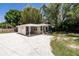 Single story home with a carport and manicured lawn at 2112 Mark Ave, Punta Gorda, FL 33950