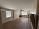 A living room undergoing renovation with exposed brick wall at 2112 Mark Ave, Punta Gorda, FL 33950