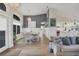 Elegant dining room with white table and chairs, and a view into the kitchen at 430 Spring Lake Nw Blvd, Port Charlotte, FL 33952