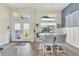 Bright dining area with white table and chairs, and large windows at 430 Spring Lake Nw Blvd, Port Charlotte, FL 33952