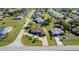 Aerial view of home featuring a spacious backyard with a sparkling pool, mature landscaping, and a private setting at 98 Seasons Dr, Punta Gorda, FL 33983