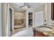 Bathroom features a tile shower with glass enclosure and a vanity with granite countertop at 98 Seasons Dr, Punta Gorda, FL 33983