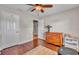 Bedroom with hardwood floors, ceiling fan, and spacious storage at 98 Seasons Dr, Punta Gorda, FL 33983