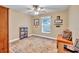 Bedroom area featuring hardwood floors, a ceiling fan, and ample natural light at 98 Seasons Dr, Punta Gorda, FL 33983