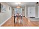 Bright dining room with stylish light fixture and seating for four at 98 Seasons Dr, Punta Gorda, FL 33983