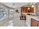 Bright kitchen and breakfast nook with tile flooring and a large window at 98 Seasons Dr, Punta Gorda, FL 33983