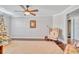 Bright living room with ceiling fan, neutral walls, and hardwood floors, providing a serene and inviting atmosphere at 98 Seasons Dr, Punta Gorda, FL 33983