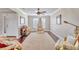 Bright living room featuring hardwood floors, ceiling fan, and large window at 98 Seasons Dr, Punta Gorda, FL 33983