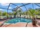 Screened-in pool and patio with landscaping at 98 Seasons Dr, Punta Gorda, FL 33983