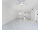 Spacious living room with tile floors and ceiling fan at 1345 Mediterranean Dr # A102, Punta Gorda, FL 33950