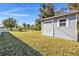 Gray shed in a sunny backyard at 2387 Tamarind St, Port Charlotte, FL 33948