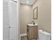 Small bathroom with a pedestal sink and toilet at 2387 Tamarind St, Port Charlotte, FL 33948