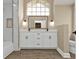 Modern bathroom with white cabinets and marble shower at 2387 Tamarind St, Port Charlotte, FL 33948