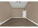 Well-lit bedroom with wood-look floors and neutral walls at 2387 Tamarind St, Port Charlotte, FL 33948