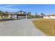 House exterior showcasing a large driveway and garage at 2387 Tamarind St, Port Charlotte, FL 33948