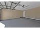 Spacious garage with ample storage space and overhead lighting at 2387 Tamarind St, Port Charlotte, FL 33948