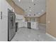 Modern kitchen with stainless steel appliances and white cabinets at 2387 Tamarind St, Port Charlotte, FL 33948