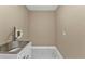 Bright laundry room with stainless steel sink at 2387 Tamarind St, Port Charlotte, FL 33948