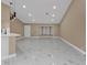 Open living space with marble floors and a breakfast bar at 2387 Tamarind St, Port Charlotte, FL 33948