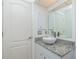 Modern bathroom with granite countertop, vessel sink, and white cabinetry at 279 Mariner Ln, Rotonda West, FL 33947