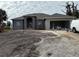 Newly constructed one-story home with attached garage and landscaping to be completed at 233 W Pine Valley Ln, Rotonda West, FL 33947