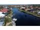 Stunning aerial view of waterfront homes with private docks and boats along a scenic canal at 3448 Nighthawk Ct, Punta Gorda, FL 33950