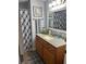 Modern bathroom with vanity, shower and updated flooring at 6603 Hauli Ct, North Port, FL 34287