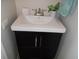 Clean bathroom vanity with dark wood cabinet and chrome faucet at 6603 Hauli Ct, North Port, FL 34287