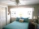 Bedroom with window, dresser, and bed at 6603 Hauli Ct, North Port, FL 34287