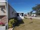 Home exterior showcasing landscaping and a welcoming entrance at 6603 Hauli Ct, North Port, FL 34287