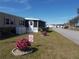Home exterior with landscaping and a welcoming entrance at 6603 Hauli Ct, North Port, FL 34287