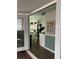 View into kitchen with table and chairs from sunroom at 6603 Hauli Ct, North Port, FL 34287