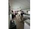 Open kitchen features island with seating and breakfast bar at 6603 Hauli Ct, North Port, FL 34287