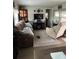 Spacious living room with comfortable seating and large TV at 6603 Hauli Ct, North Port, FL 34287