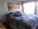 Main bedroom with king-size bed and calming decor at 6603 Hauli Ct, North Port, FL 34287