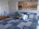 Main bedroom with king-size bed and inspirational wall art at 6603 Hauli Ct, North Port, FL 34287