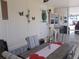 Screened-in sunroom with outdoor furniture and partial view at 6603 Hauli Ct, North Port, FL 34287