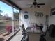 Screened sunroom with outdoor furniture and a view at 6603 Hauli Ct, North Port, FL 34287