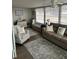 Bright sunroom with seating area, large windows and wood-look flooring at 6603 Hauli Ct, North Port, FL 34287