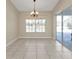 Dining room with tile floors, sliding doors, and view to pool at 7146 Sablon Rd, North Port, FL 34291